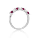 A platinum ruby and diamond seven stone half eternity ring with a v-collet setting, belonging to H. L. Brown's Volante collection.