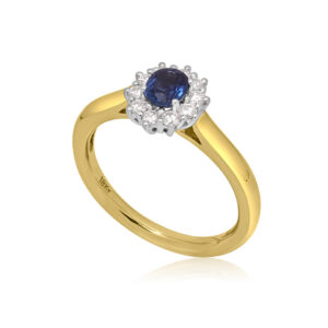 An 18ct gold, oval sapphire and brilliant cut diamond set cluster ring.