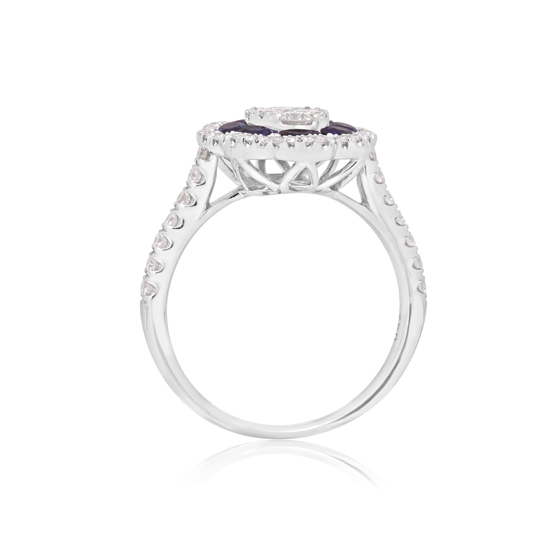 18ct White Gold Sapphire & Diamond Flower Cluster Ring An 18ct white gold oval shaped sapphire and diamond flower cluster ring, with diamond set shoulders.