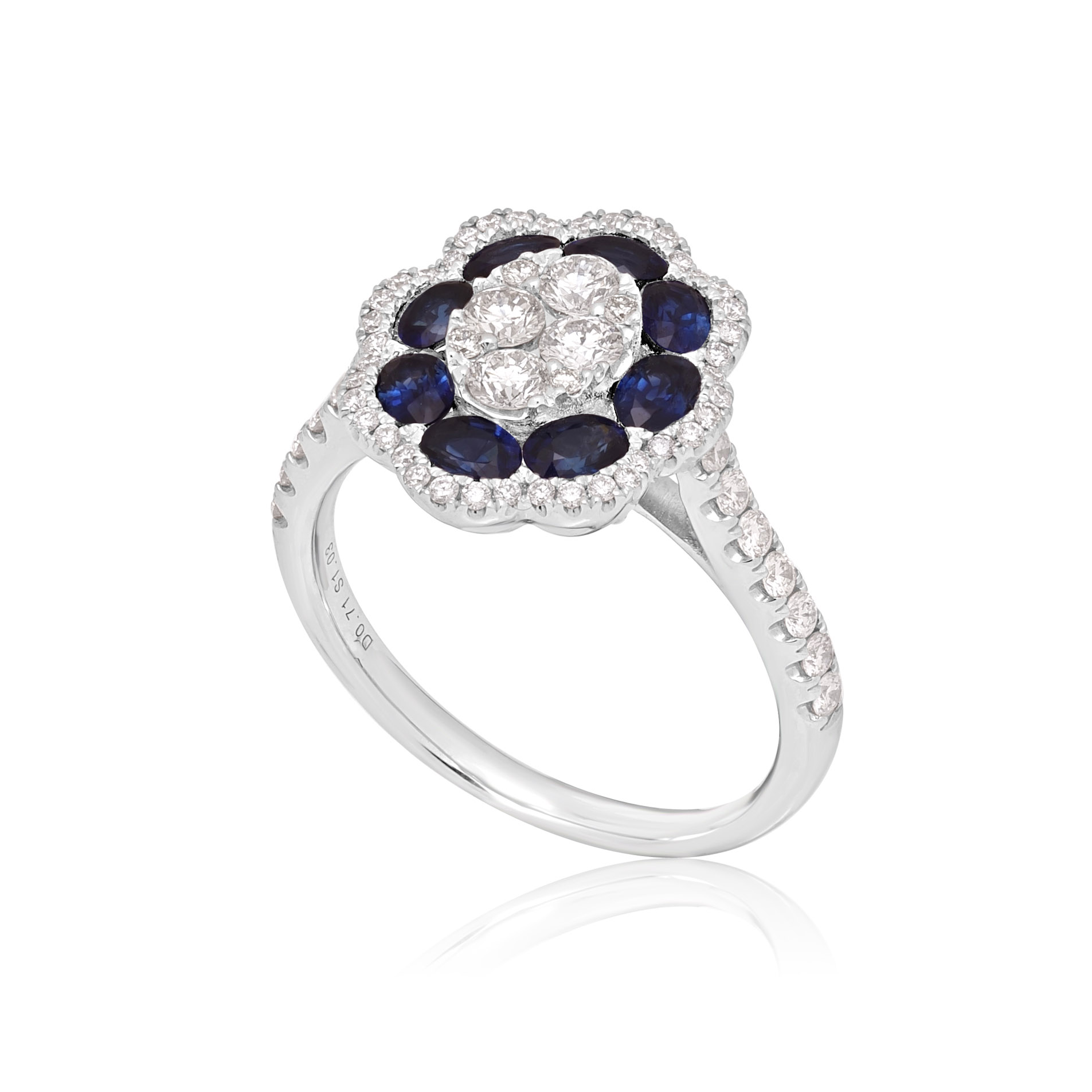 18ct White Gold Sapphire & Diamond Flower Cluster Ring An 18ct white gold oval shaped sapphire and diamond flower cluster ring, with diamond set shoulders.