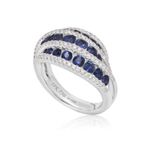 An 18ct white gold, sapphire and diamond swirl set dress ring.