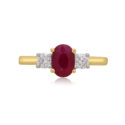 An 18ct yellow gold oval ruby and round brilliant cut diamond three stone ring.