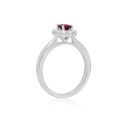Platinum Oval Ruby & Brilliant Cut Diamond Cluster Ring A platinum, oval shaped ruby and brilliant cut diamond set cluster ring.