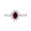 Platinum Oval Ruby & Brilliant Cut Diamond Cluster Ring A platinum, oval shaped ruby and brilliant cut diamond set cluster ring.