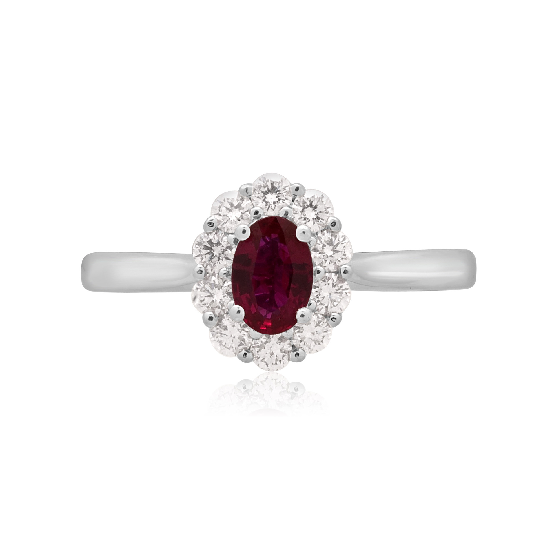 Platinum Oval Ruby & Brilliant Cut Diamond Cluster Ring A platinum, oval shaped ruby and brilliant cut diamond set cluster ring.