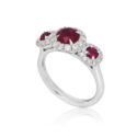 Platinum Ruby & Diamond Triple Cluster Ring A platinum ruby and brilliant cut diamond set triple cluster ring.