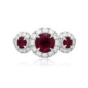 Platinum Ruby & Diamond Triple Cluster Ring A platinum ruby and brilliant cut diamond set triple cluster ring.