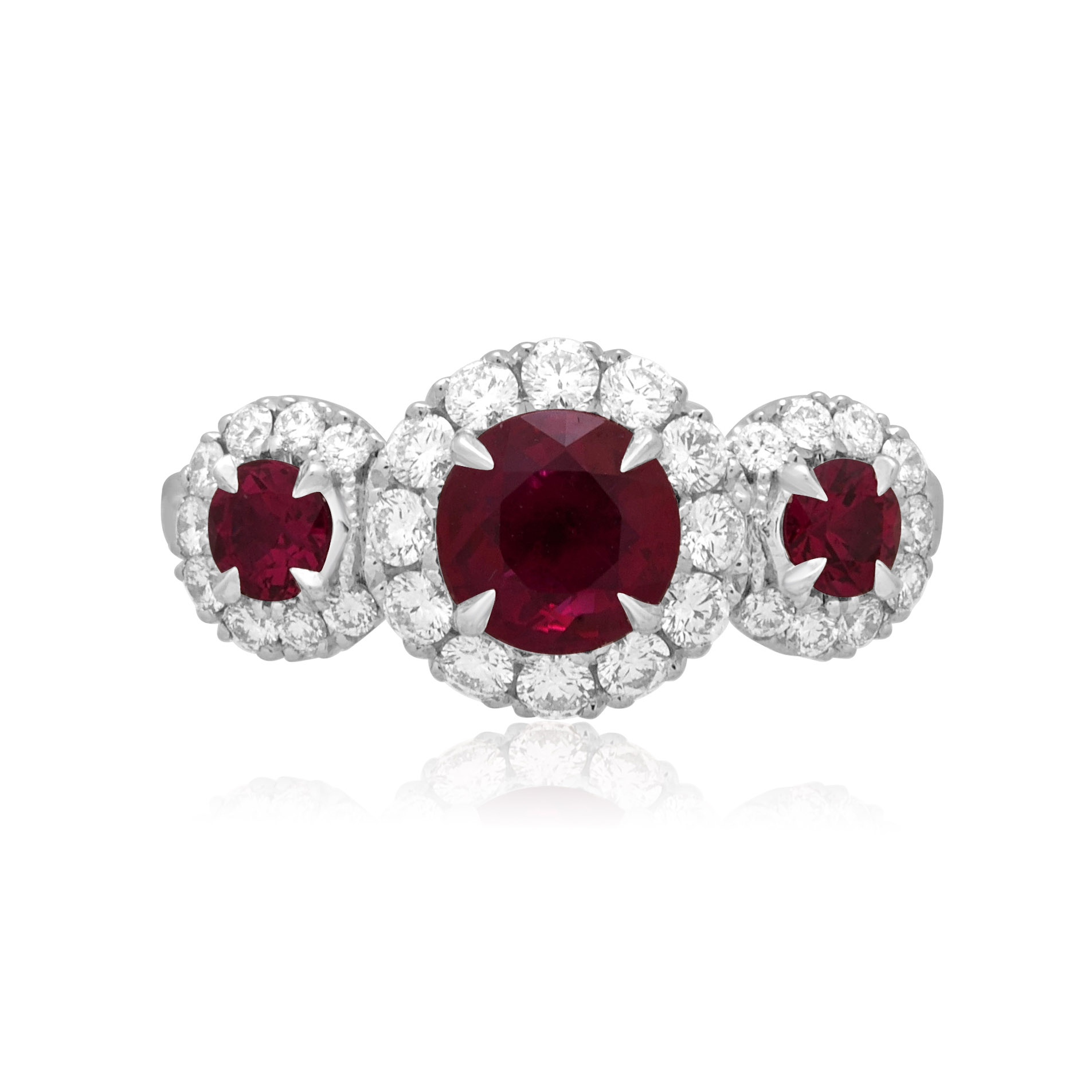 Platinum Ruby & Diamond Triple Cluster Ring A platinum ruby and brilliant cut diamond set triple cluster ring.