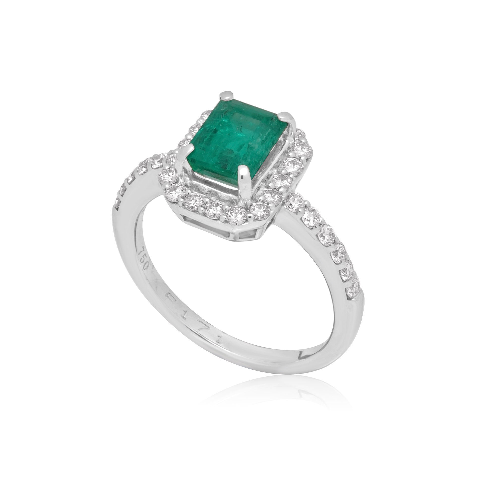 An 18ct white gold emerald and brilliant cut diamond cluster ring with diamond set shoulders.