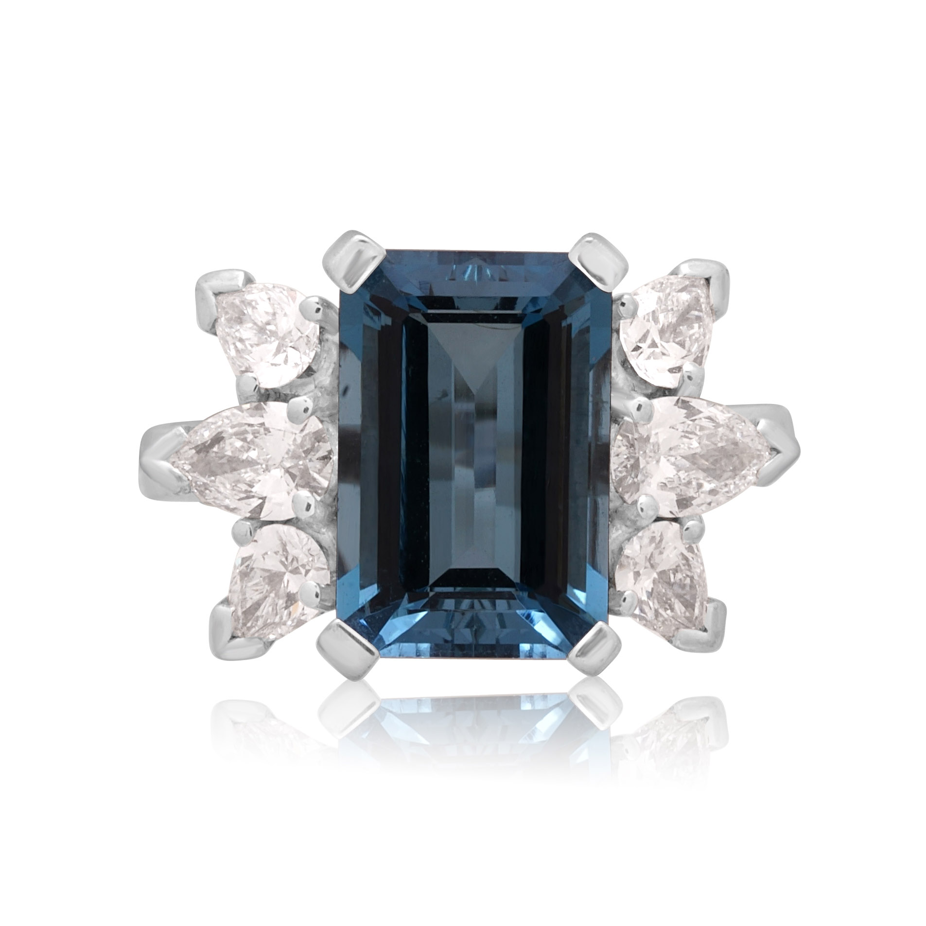 18ct White Gold Emerald Cut Aquamarine & Diamond Dress Ring An 18ct white gold emerald cut aquamarine ring with pear shaped diamond set shoulders.