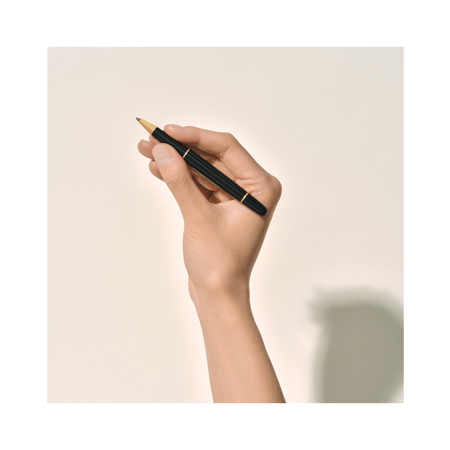 Montblanc, Meisterstück Gold-Coated Classique Rollerball A Montblanc, Meisterstück Gold-Coated Classique Rollerball pen crafted in black precious resin with gold coated fittings featuring the white star emblem.