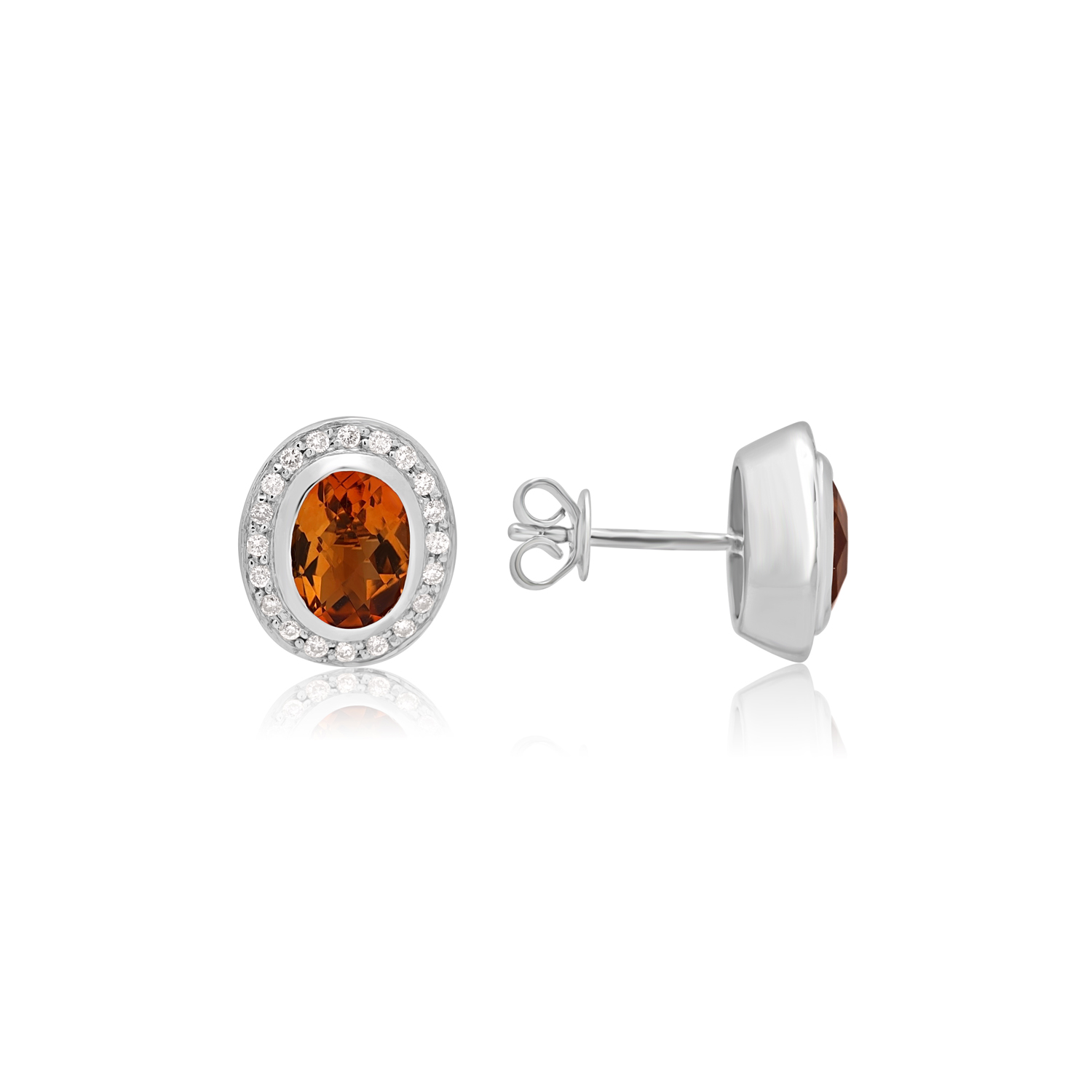 14ct White Gold Oval Citrine & Diamond Cluster Stud Earrings A pair of 14ct white gold oval shaped citrine and round brilliant cut diamond set cluster stud earrings, with a post and butterfly clip fastening for pierced ears.