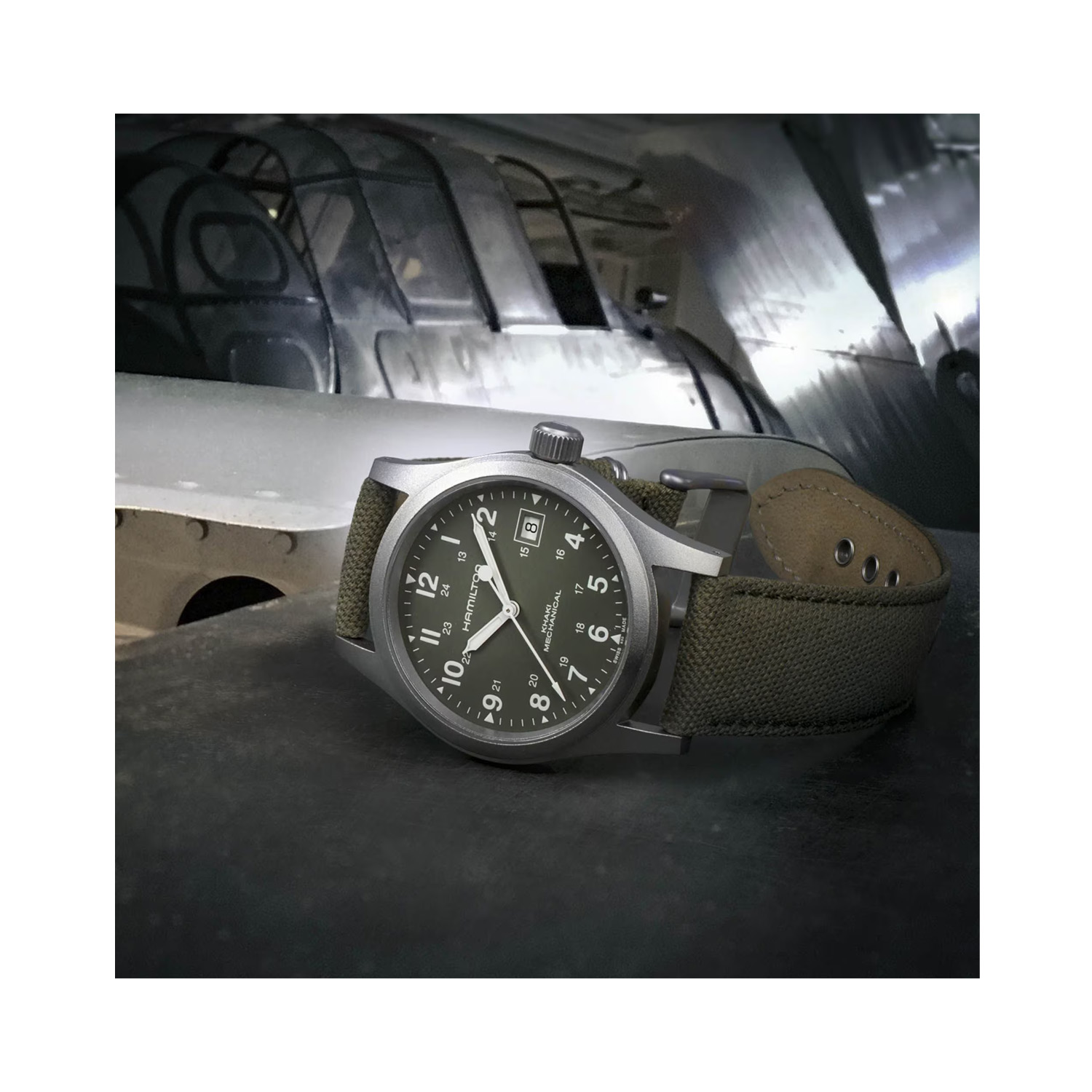 Hamilton, Khaki Field with a 38mm stainless steel case and khaki coloured canvas strap featuring a date function and a black dial.