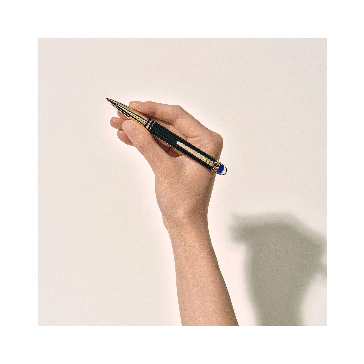 A Montblanc, StarWalker Doué Ballpoint pen crafted in black precious resin with platinum coated fittings, featuring a blue translucent dome beneath the Montblanc emblem.