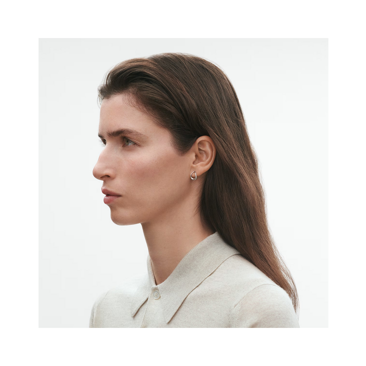 A pair of polished, sterling silver stud earrings from Georg Jensen's Offspring collection, for pierced ears.