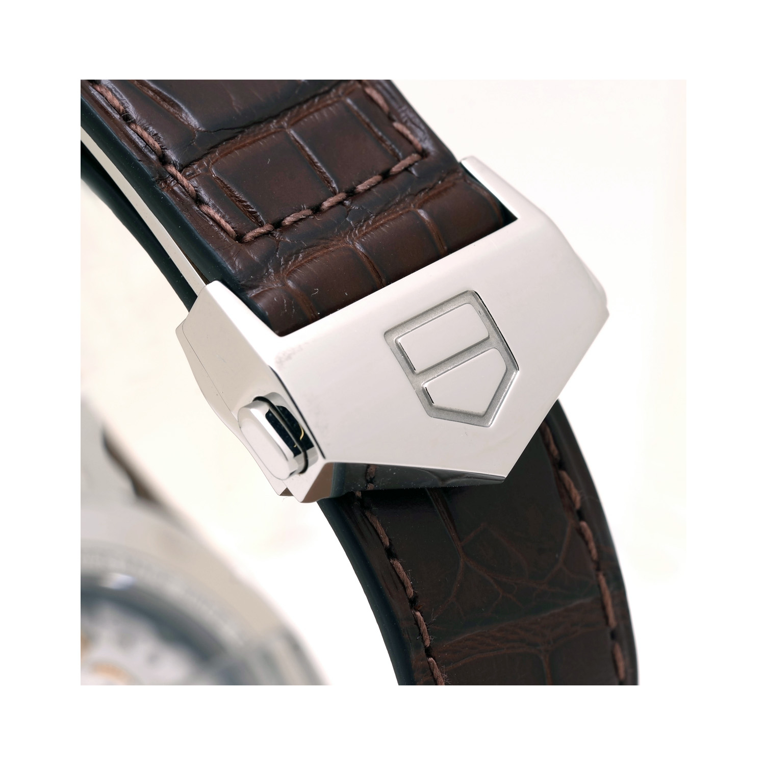 Tag Heuer, Carrera Calibre 5 with a 39mm stainless steel case and a brown leather strap featuring a date function and a silver dial.
