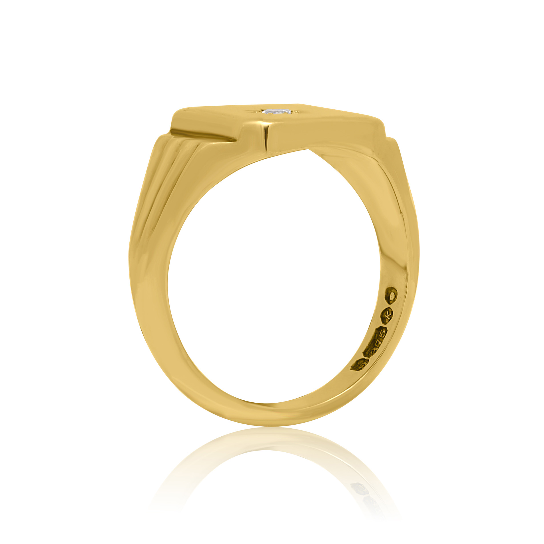 A 9ct yellow gold oblong shaped signet ring set with a single diamond.