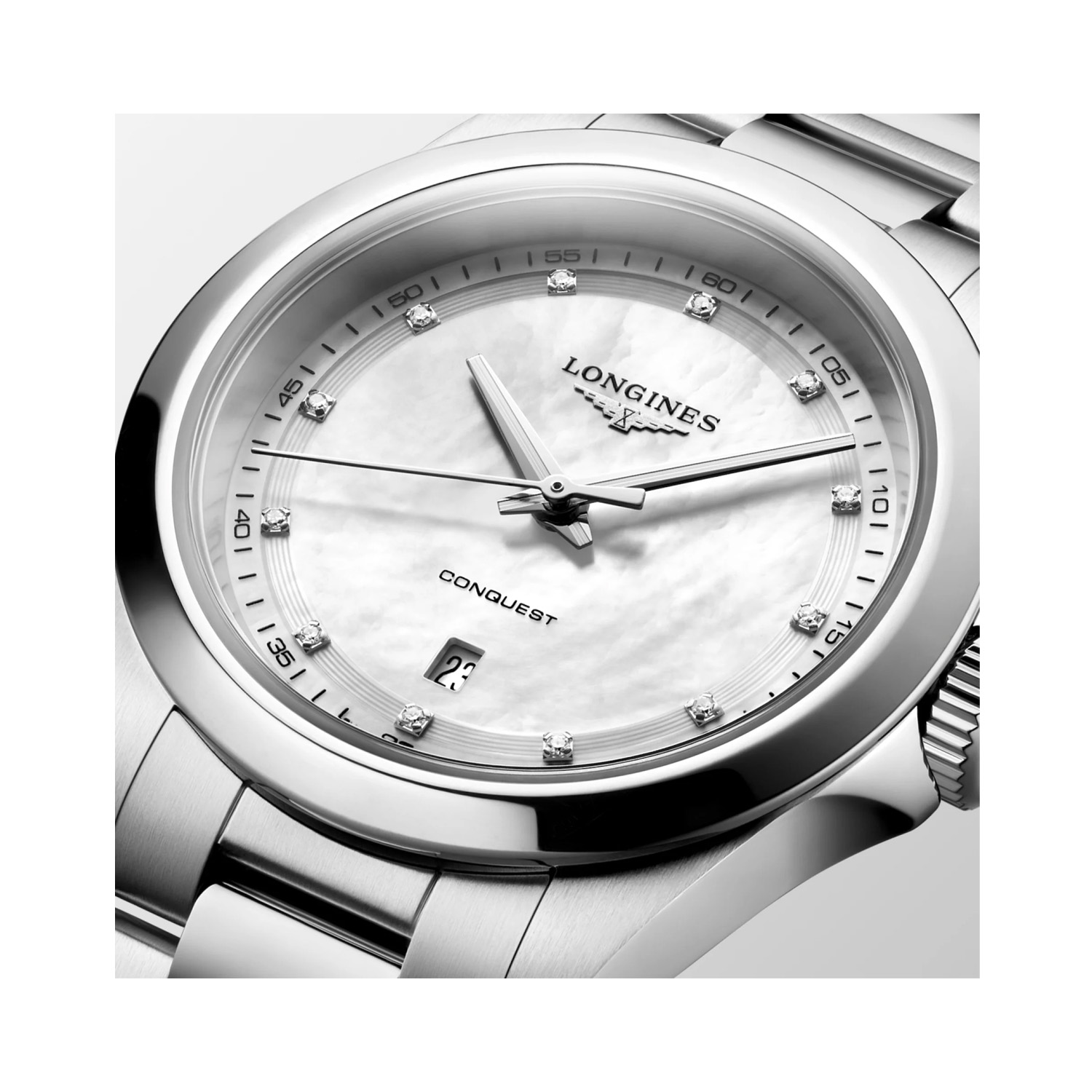 Longines, Conquest with a 30mm stainless steel case and bracelet strap featuring a date function and a white mother of pearl diamond set dial.