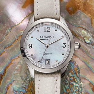 A Bremont women's watch with a white strap and a mother of pearl dial.