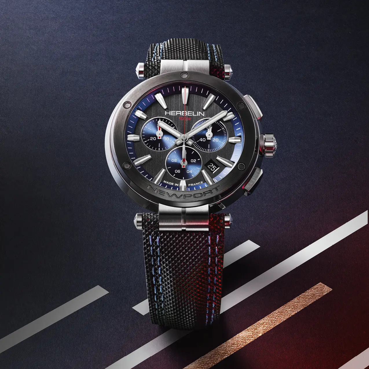 A Herbelin watch with a blue dial and a leather strap on a blue background.