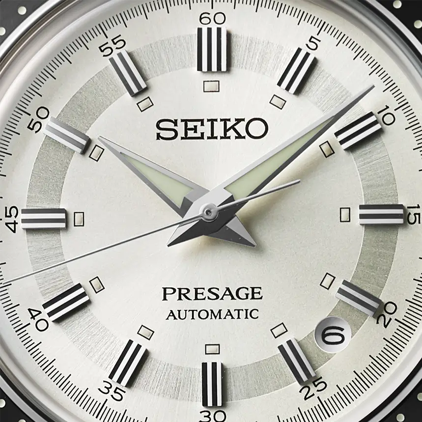 A close up of a white Seiko watch face.