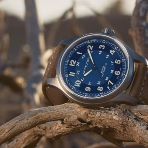 A Hamilton watch with a blue dial and a brown strap.